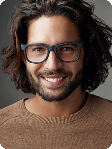 Professional man portrait in a dark shirt looking directly at the camera for CP&KRELL